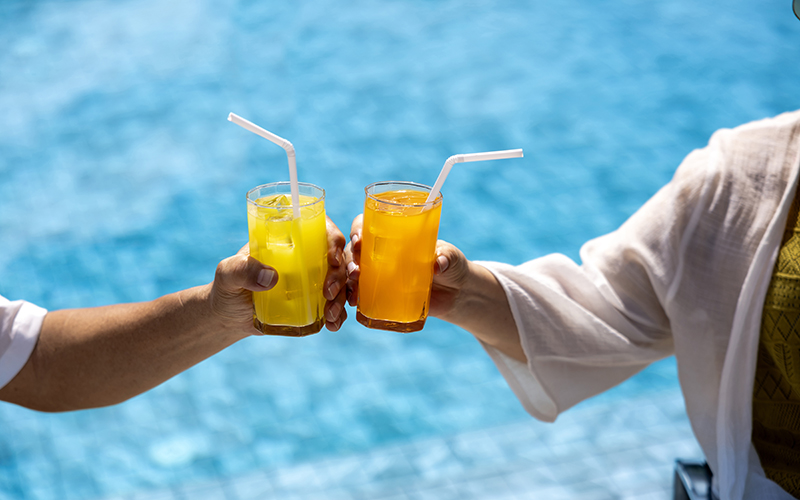 cheers by the pool